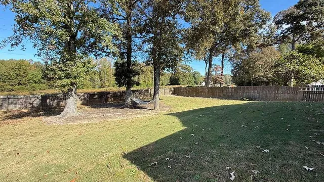 a view of yard with swimming pool