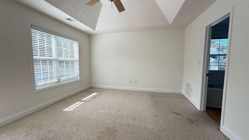 3860 Morgan Road Buford, GA 30519 - Photo 6 of 21 a view of an empty room with a window