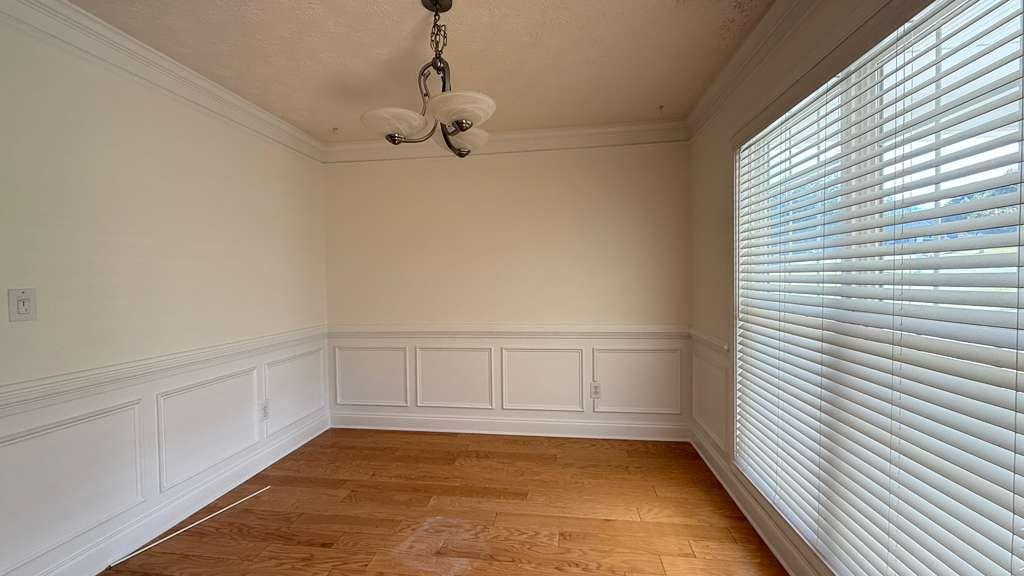 3860 Morgan Road Buford, GA 30519 - Photo 7 of 21 a view of an empty room with a window