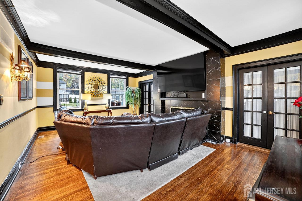 101 West Hill Road Colonia, NJ 07067 - Photo 11 of 52 a living room with furniture and a flat screen tv
