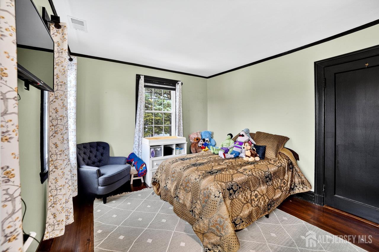 101 West Hill Road Colonia, NJ 07067 - Photo 19 of 52 a bedroom with two beds and a couch