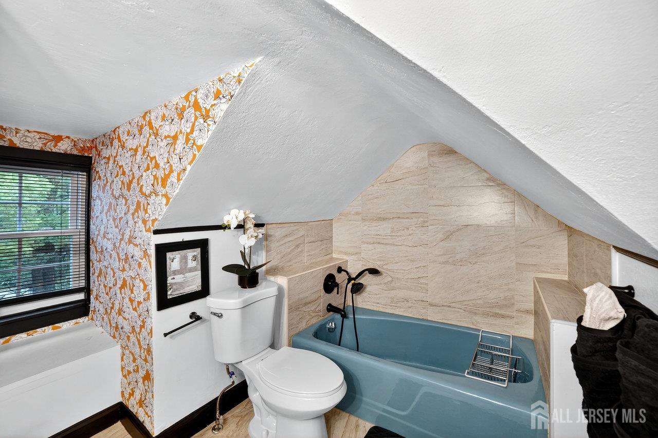 101 West Hill Road Colonia, NJ 07067 - Photo 20 of 52 a white toilet sitting next to a bathroom sink