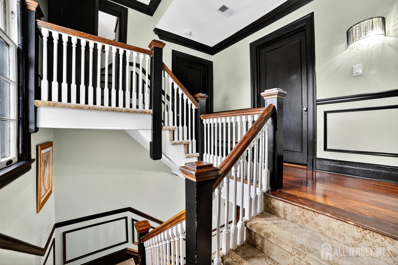 101 West Hill Road Colonia, NJ 07067 - Photo 21 of 52 a view of staircase with railing and a window