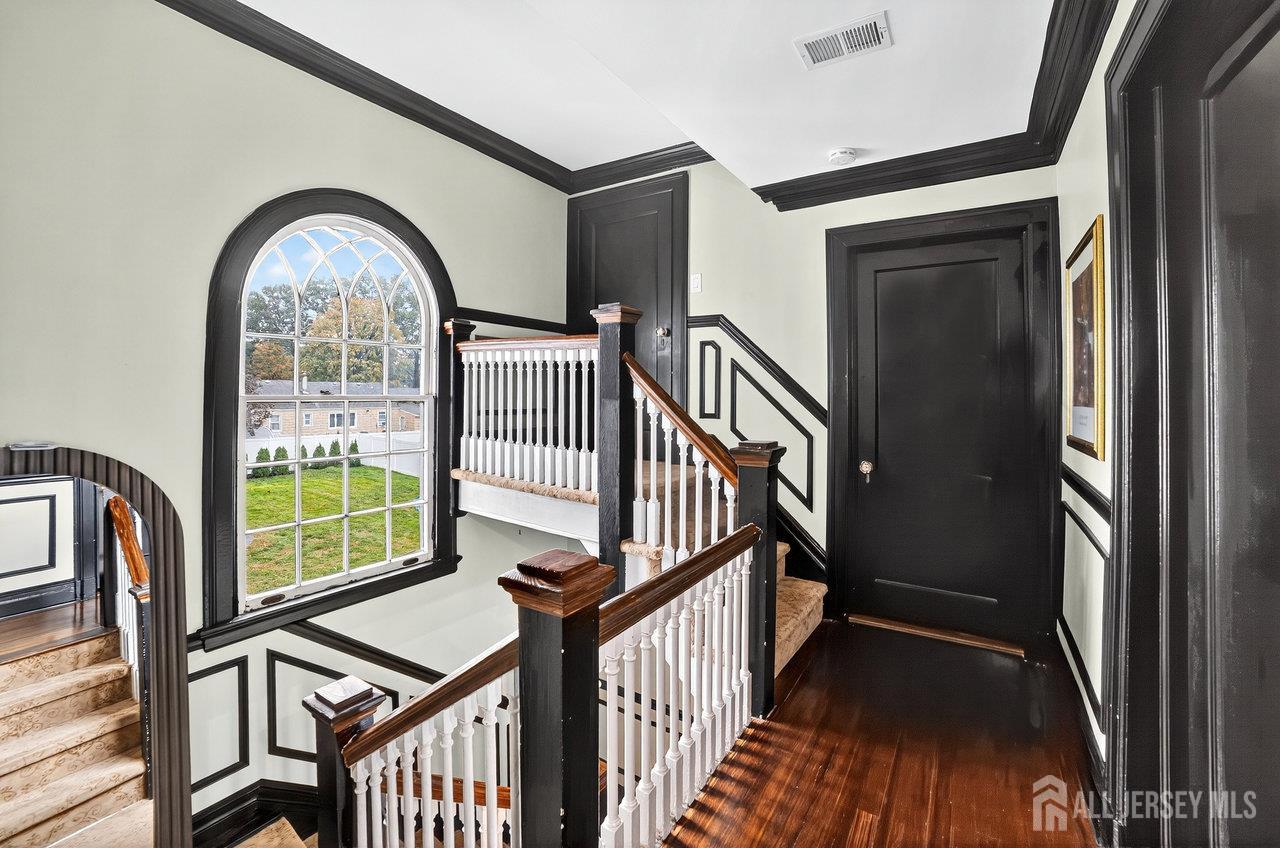 101 West Hill Road Colonia, NJ 07067 - Photo 22 of 52 a view of staircase with railing and a large window