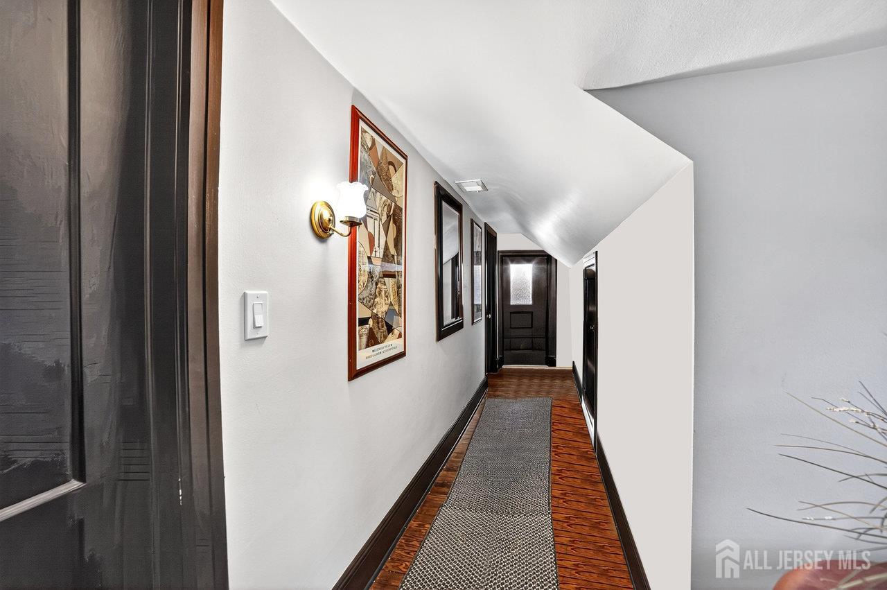 101 West Hill Road Colonia, NJ 07067 - Photo 35 of 52 a view of a hallway with wooden floor and staircase