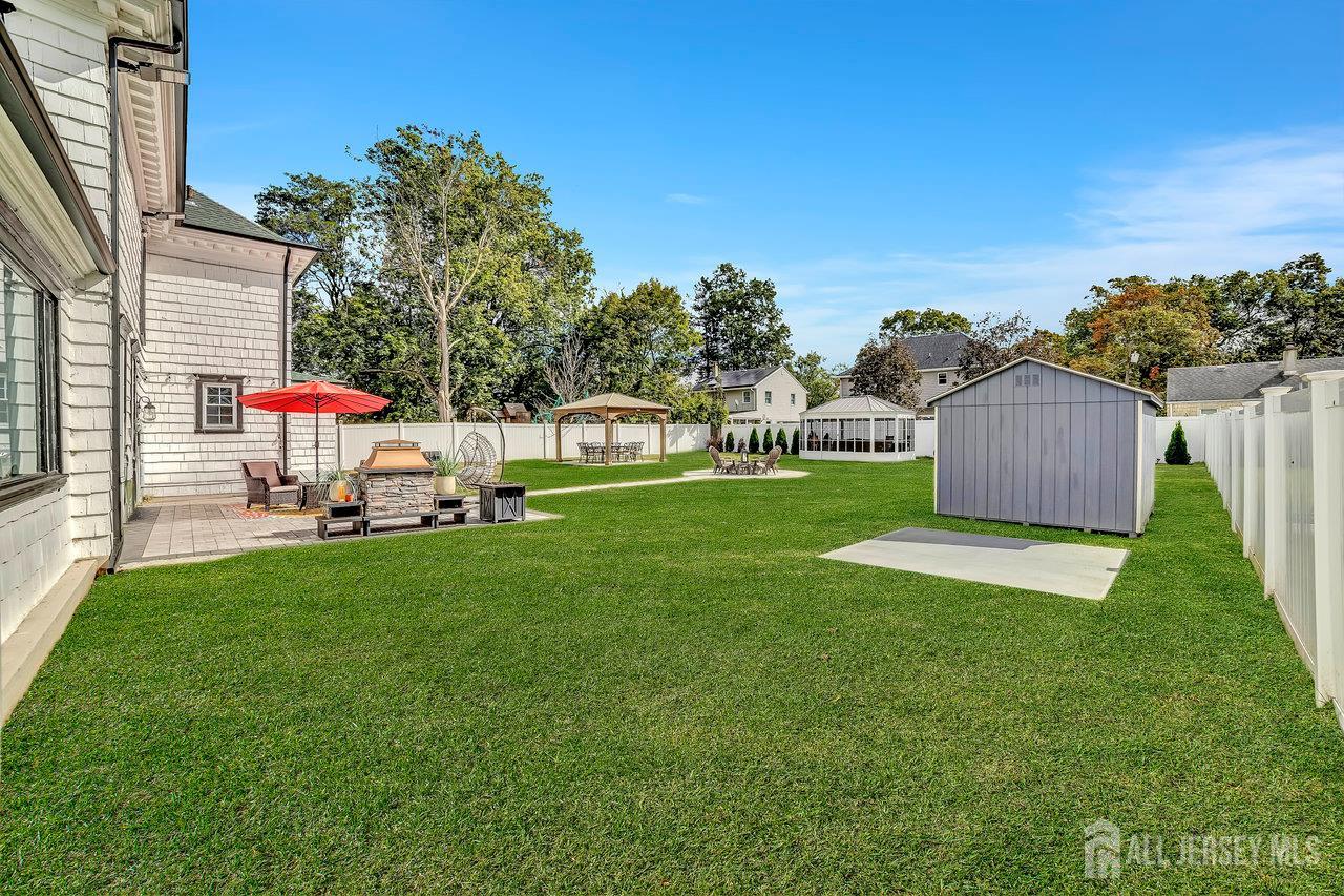 101 West Hill Road Colonia, NJ 07067 - Photo 40 of 52 a view of an house with backyard space and sitting area