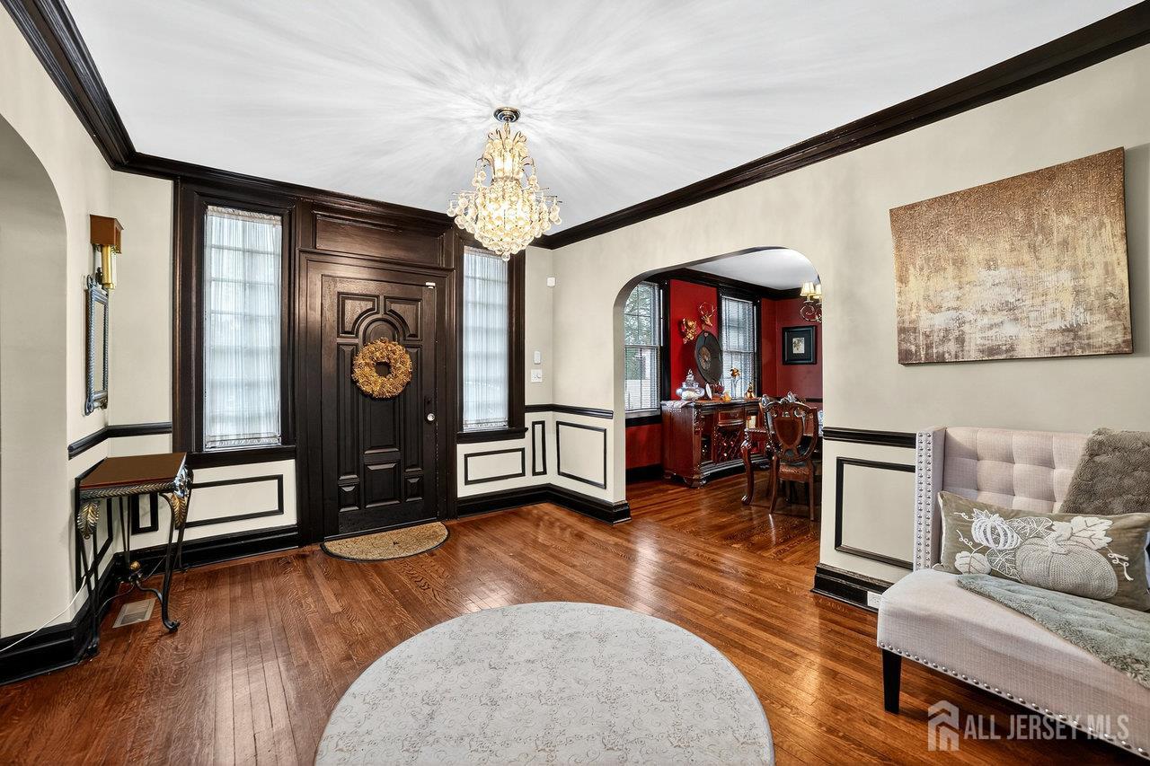 101 West Hill Road Colonia, NJ 07067 - Photo 8 of 52 a living room with furniture and a wooden floor