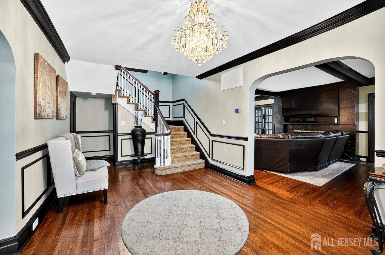 101 West Hill Road Colonia, NJ 07067 - Photo 9 of 52 a view of a livingroom with wooden floor and furniture