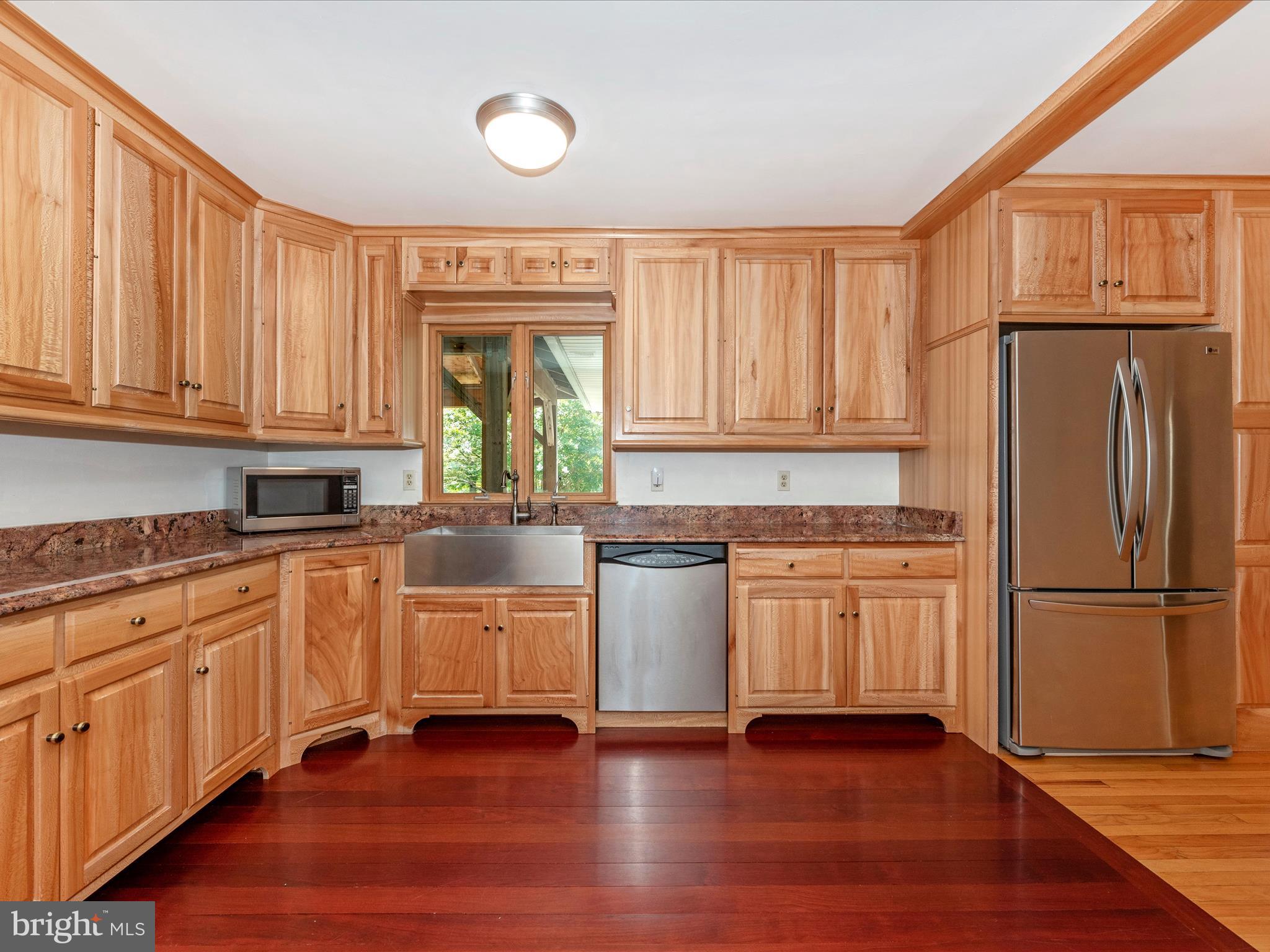 2313 Bidle Road Middletown, MD 21769 - Photo 14 of 85 a kitchen with stainless steel appliances granite countertop a refrigerator sink and cabinets