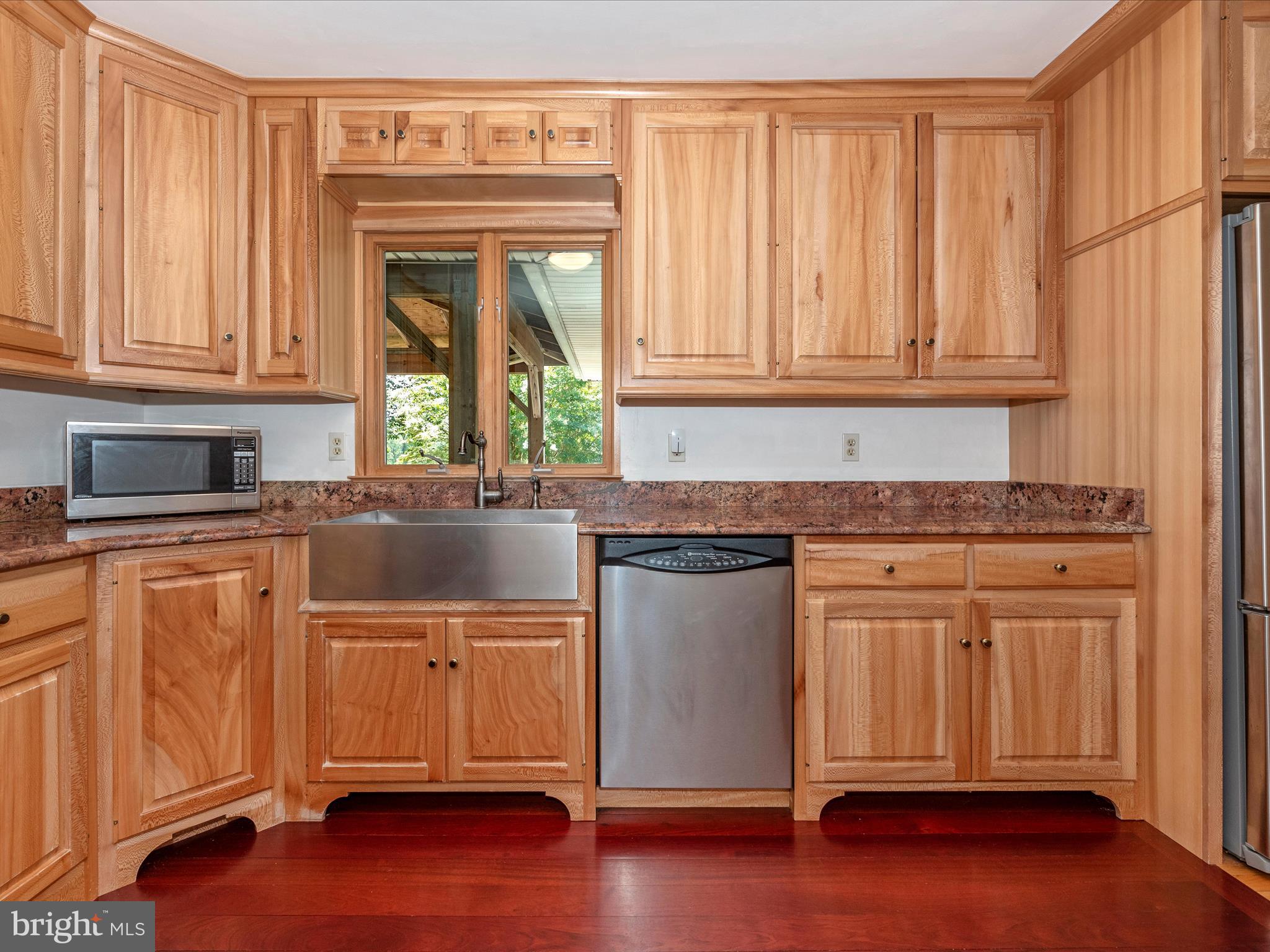 2313 Bidle Road Middletown, MD 21769 - Photo 18 of 85 a kitchen with granite countertop wooden cabinets and a granite counter tops