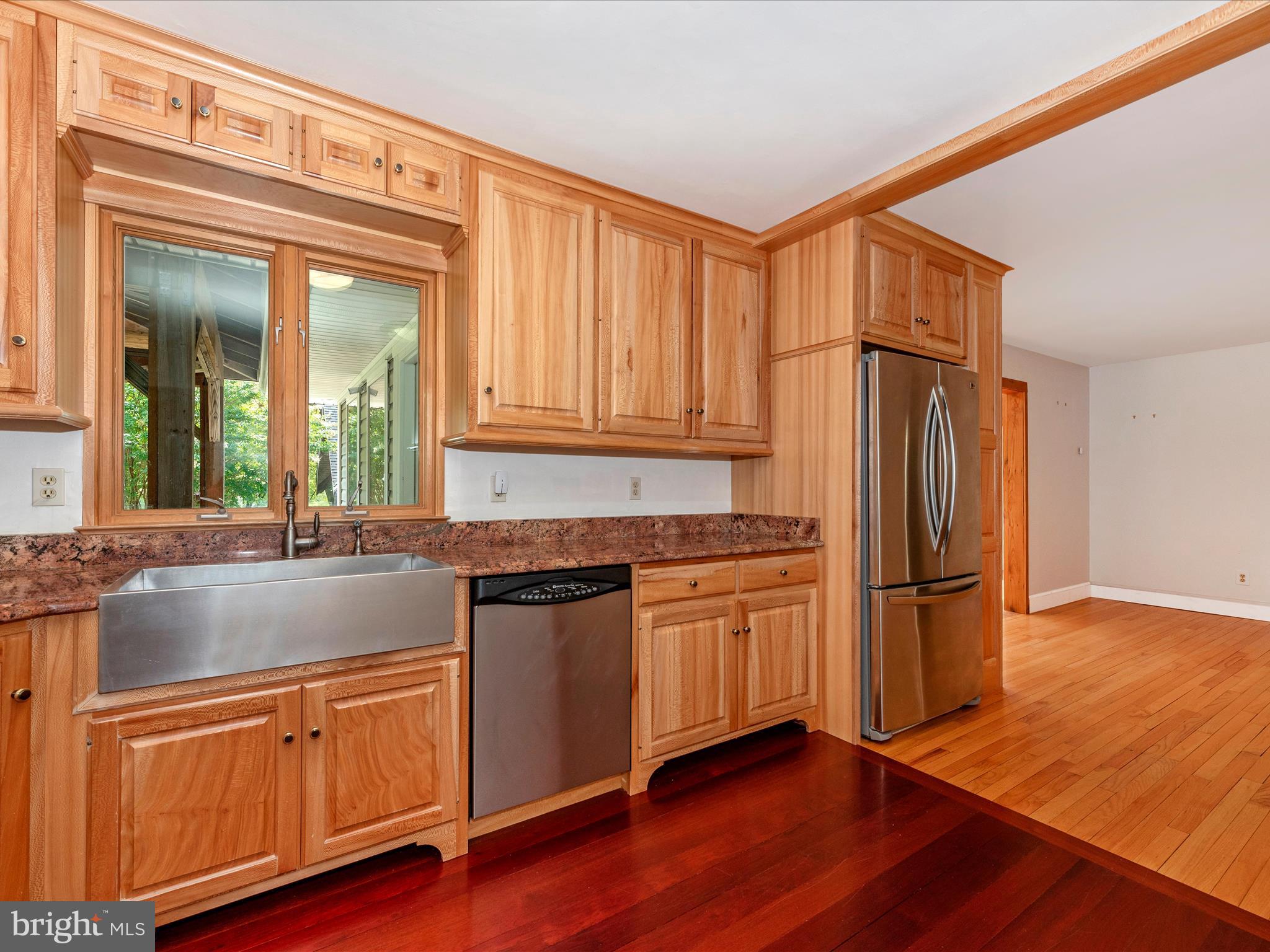 2313 Bidle Road Middletown, MD 21769 - Photo 19 of 85 a kitchen with stainless steel appliances granite countertop a refrigerator a sink and dishwasher with wooden floor