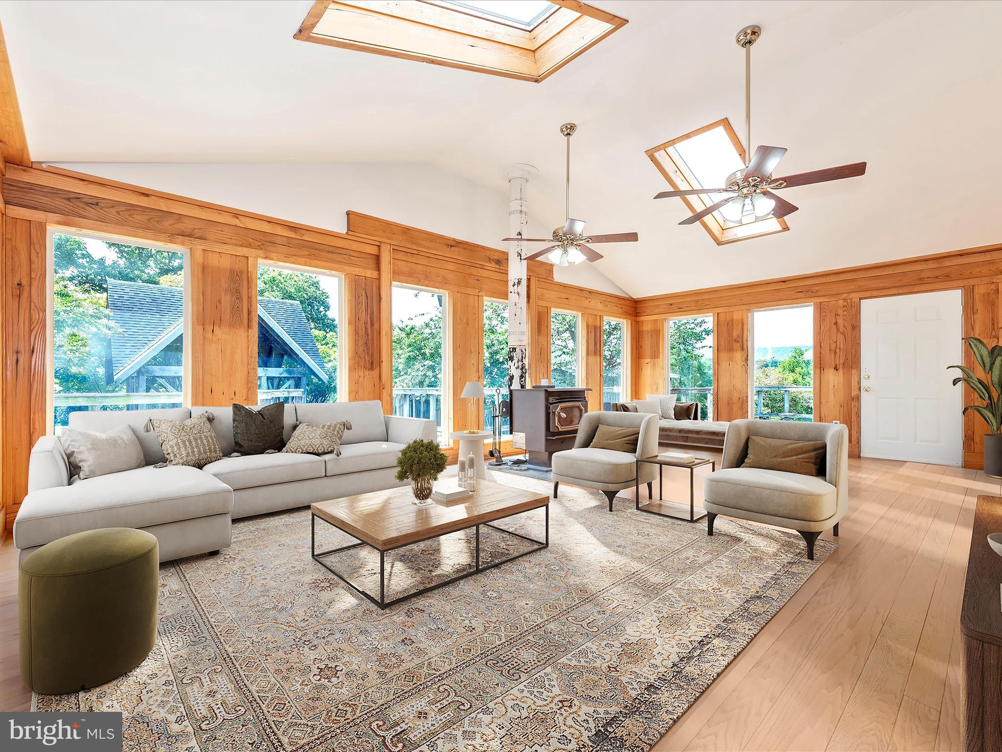 2313 Bidle Road Middletown, MD 21769 - Photo 24 of 85 a living room with furniture ceiling fan and a large window