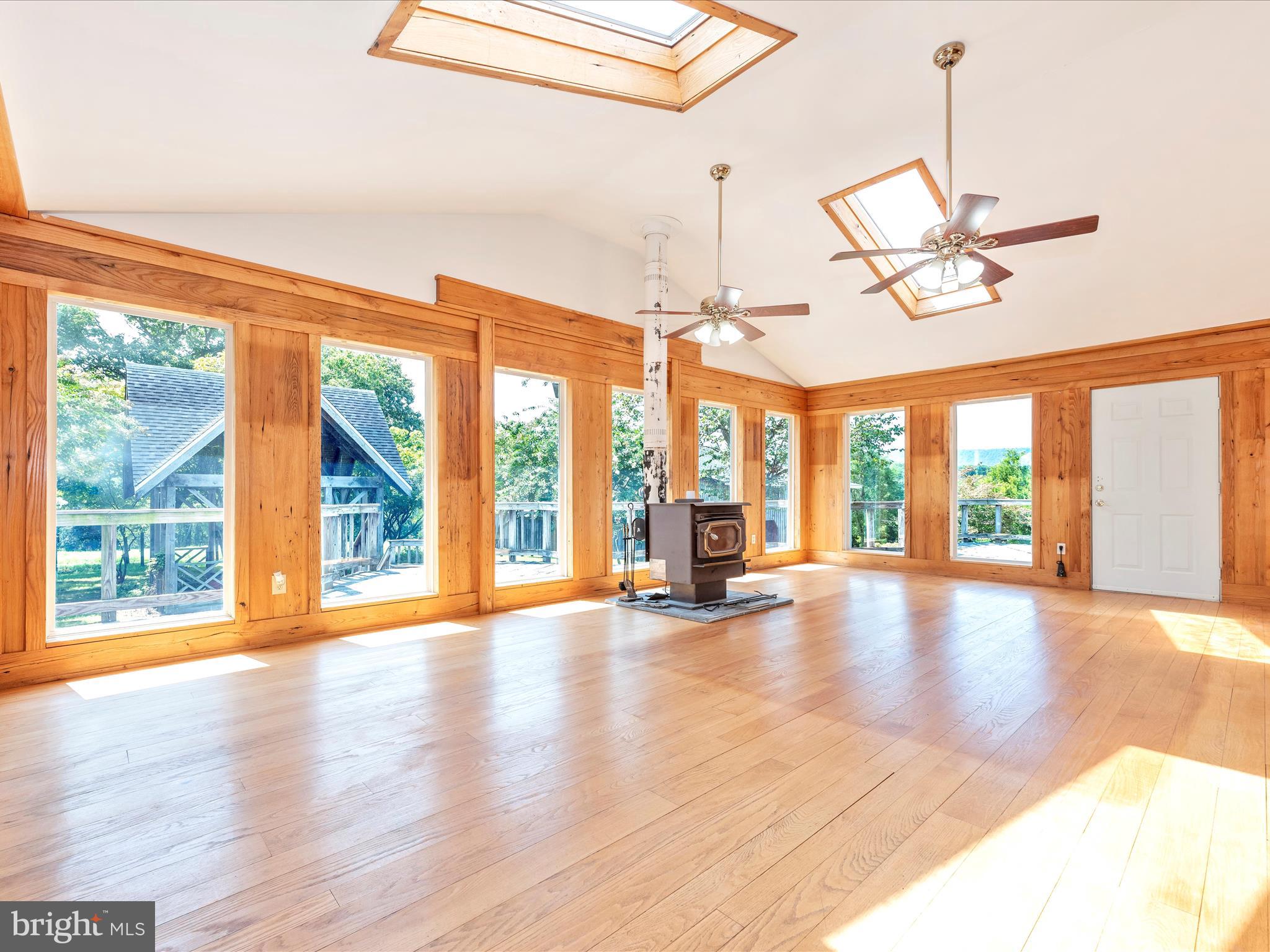 2313 Bidle Road Middletown, MD 21769 - Photo 25 of 85 a view of an empty room with a window and wooden floor