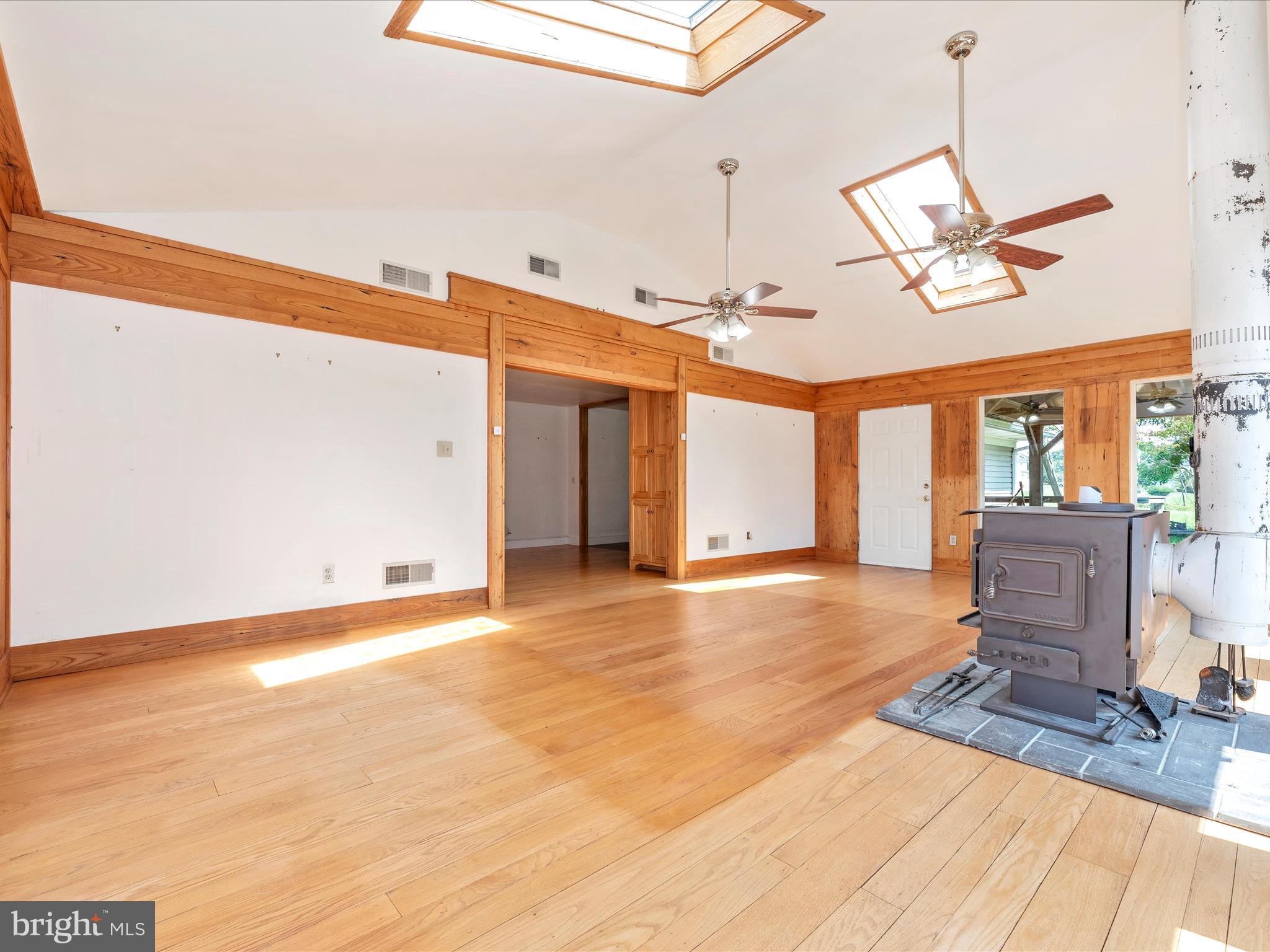 2313 Bidle Road Middletown, MD 21769 - Photo 28 of 85 a view of an empty room with a window and wooden floor
