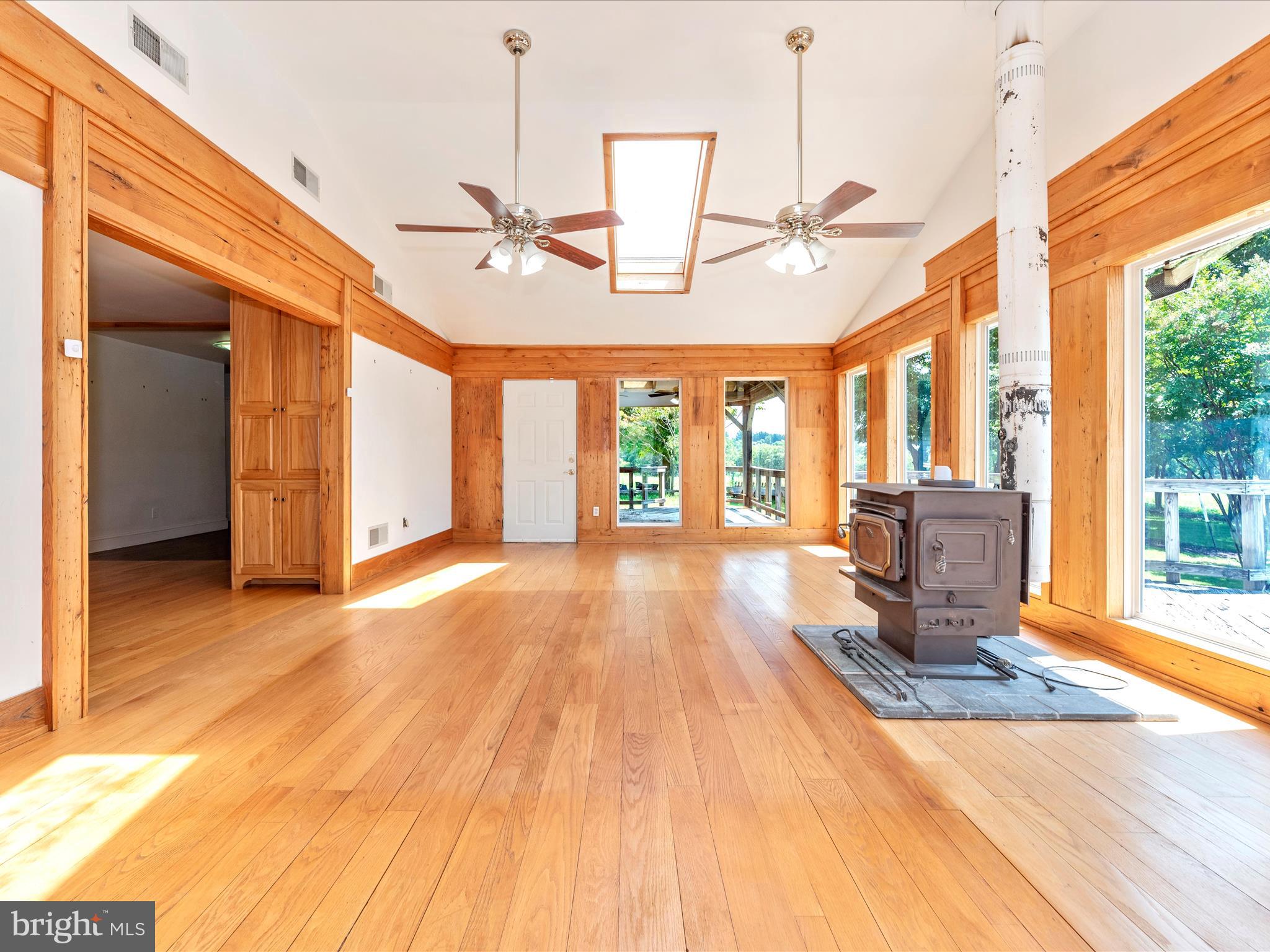 2313 Bidle Road Middletown, MD 21769 - Photo 29 of 85 a view of an empty room with wooden floor and a window