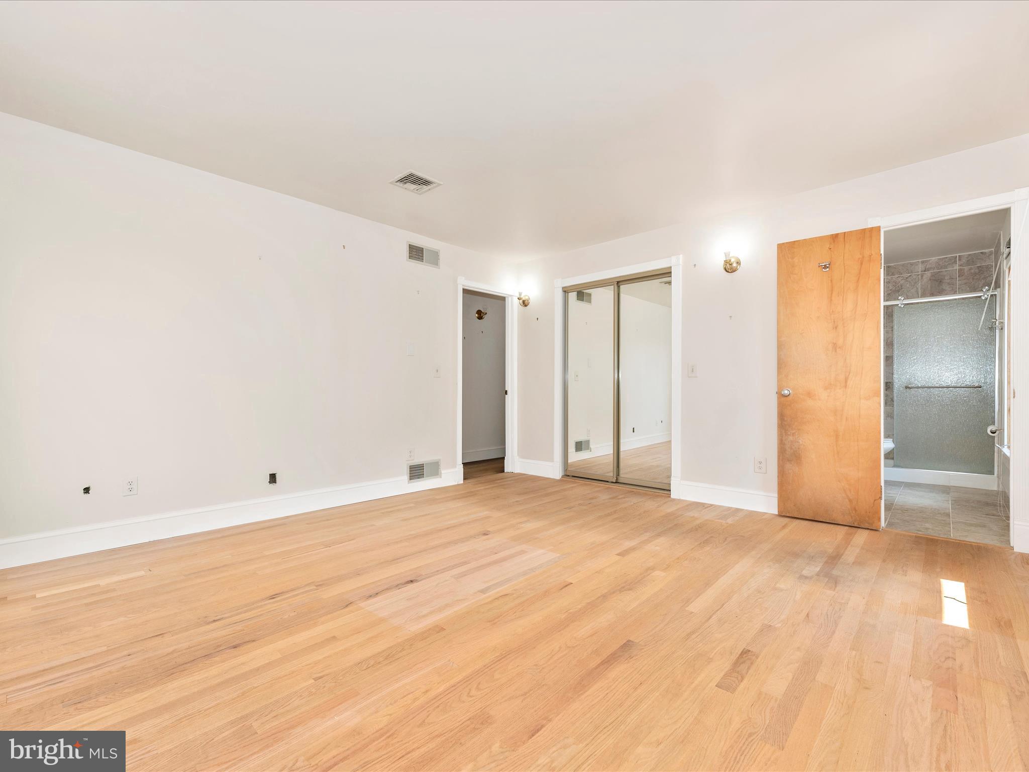 2313 Bidle Road Middletown, MD 21769 - Photo 33 of 85 a view of an empty room with wooden floor