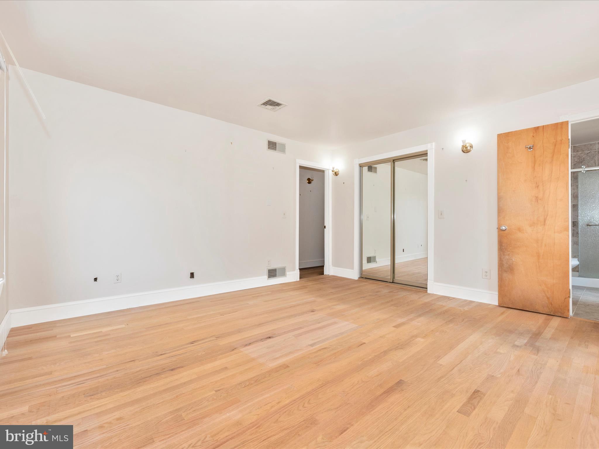 2313 Bidle Road Middletown, MD 21769 - Photo 34 of 85 a view of an empty room with wooden floor