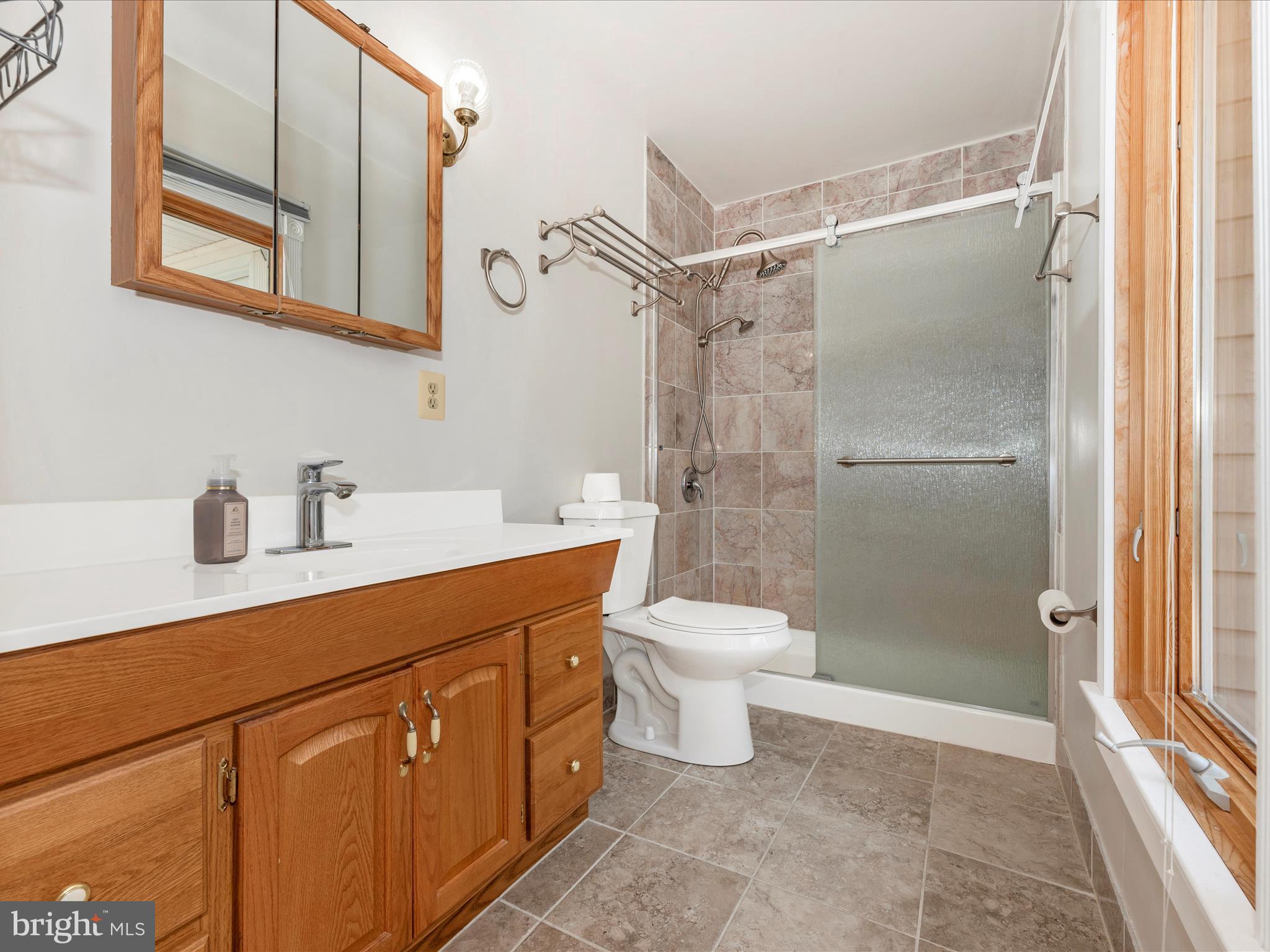 2313 Bidle Road Middletown, MD 21769 - Photo 36 of 85 a bathroom with a toilet sink and shower