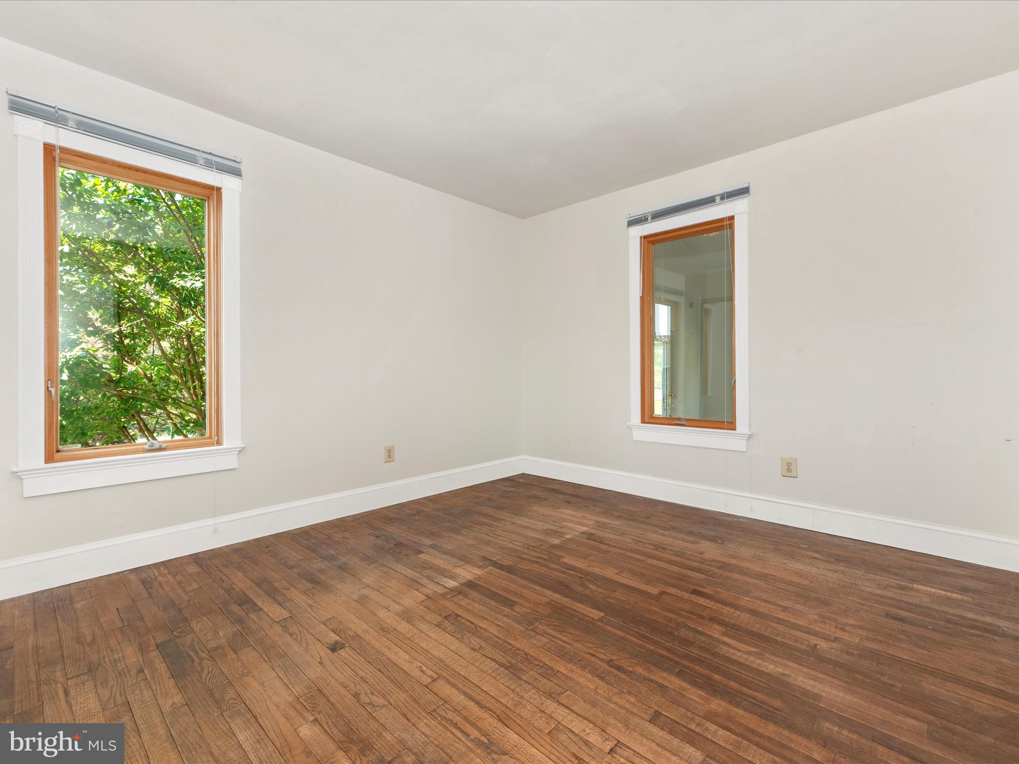 2313 Bidle Road Middletown, MD 21769 - Photo 37 of 85 a view of an empty room with wooden floor and a window