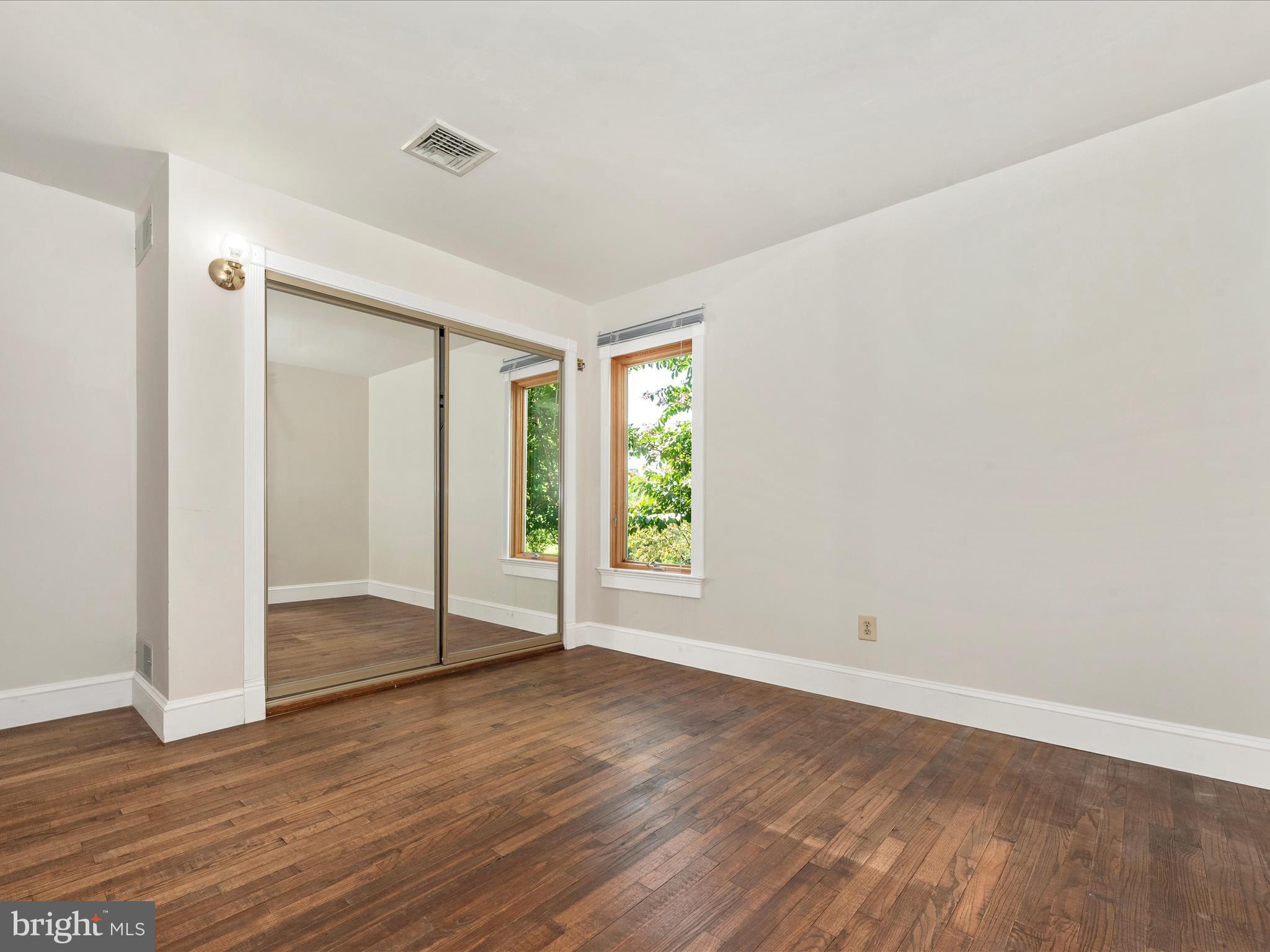 2313 Bidle Road Middletown, MD 21769 - Photo 38 of 85 an empty room with wooden floor and window