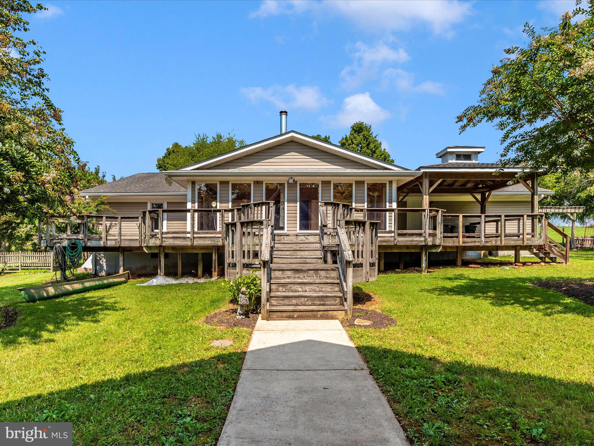 2313 Bidle Road Middletown, MD 21769 - Photo 47 of 85 a front view of a house with swimming pool and chairs