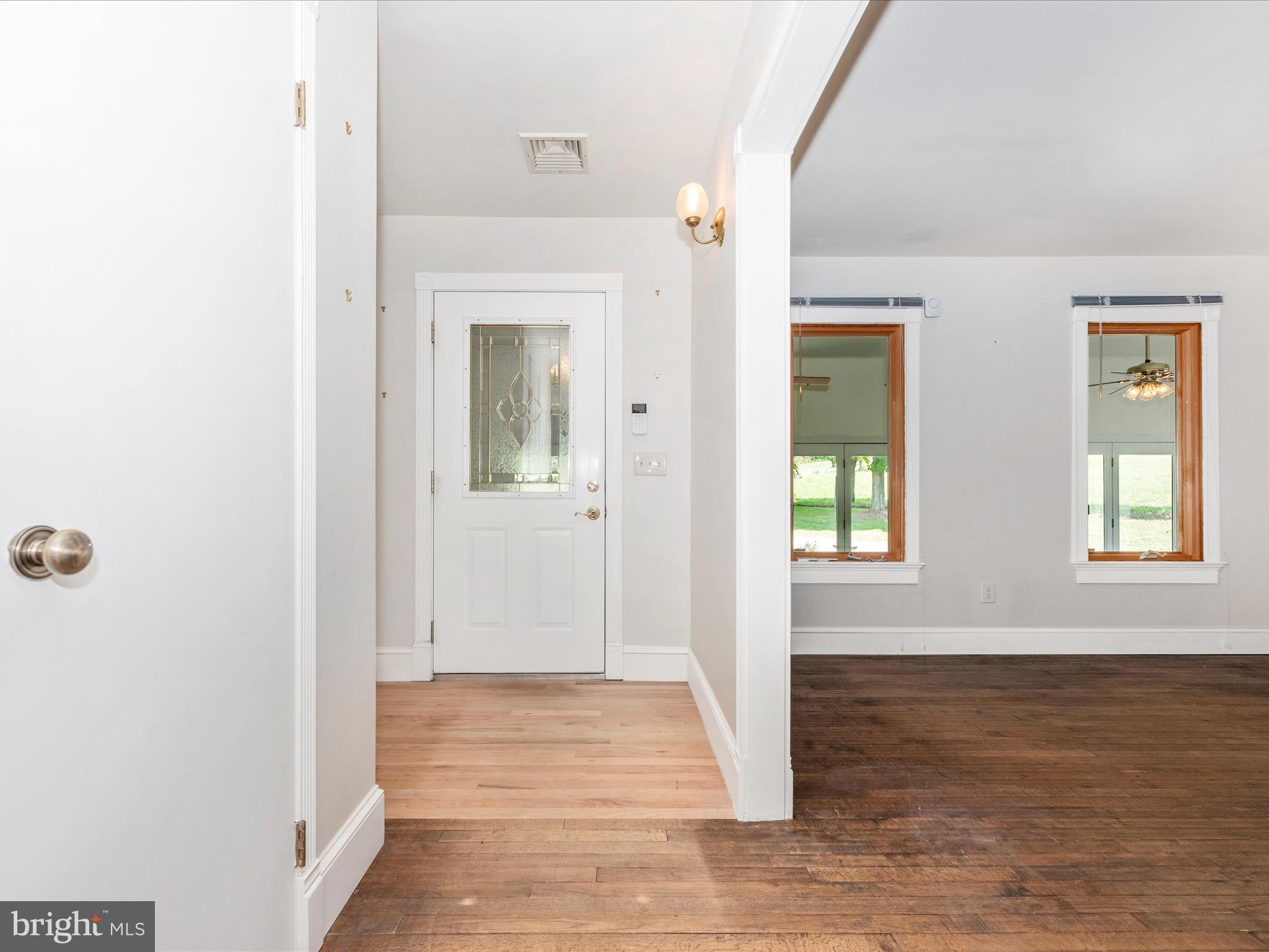 2313 Bidle Road Middletown, MD 21769 - Photo 5 of 85 a view of an empty room with wooden floor and a window