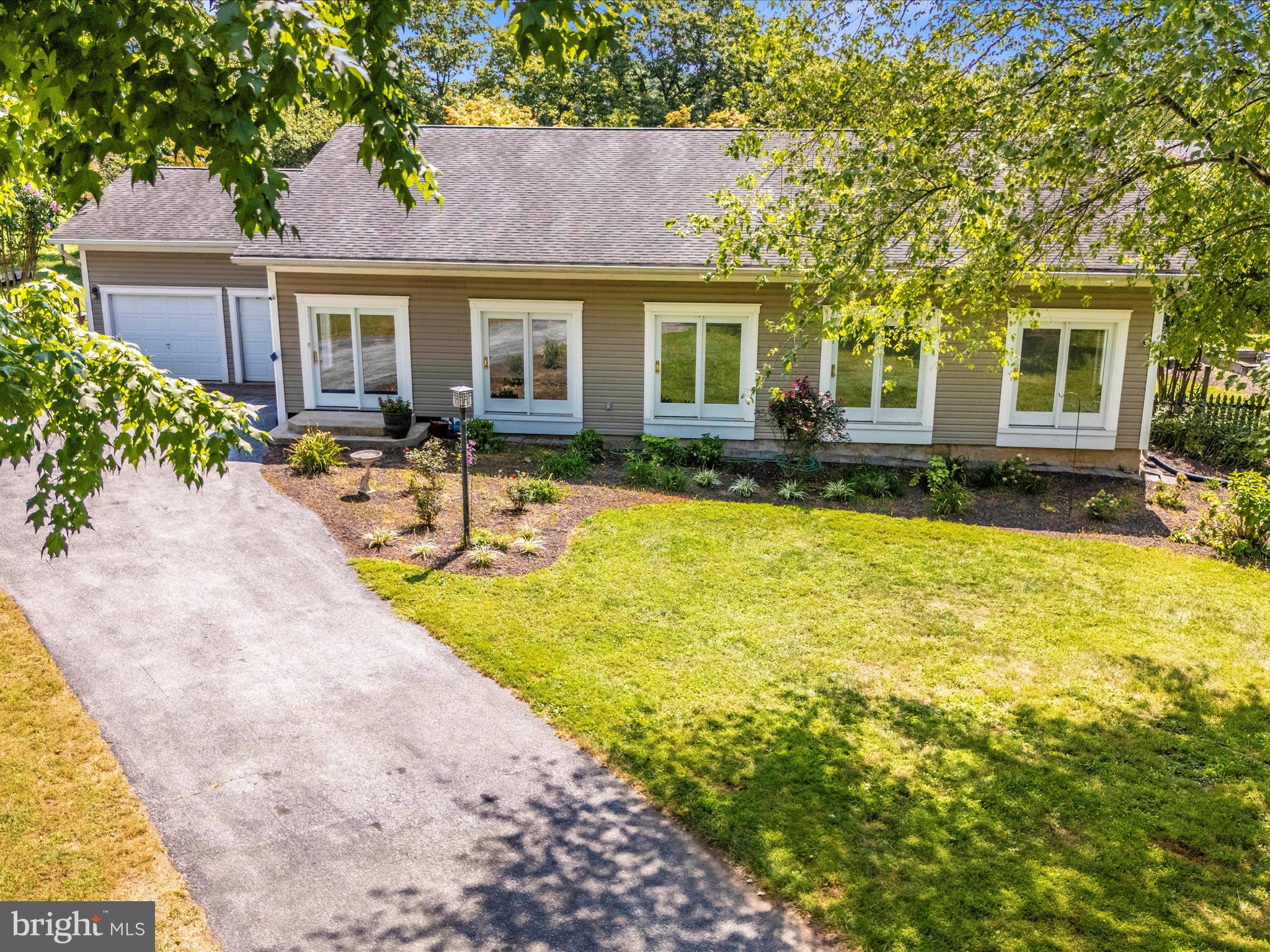 2313 Bidle Road Middletown, MD 21769 - Photo 60 of 85 a view of a house with swimming pool and sitting area