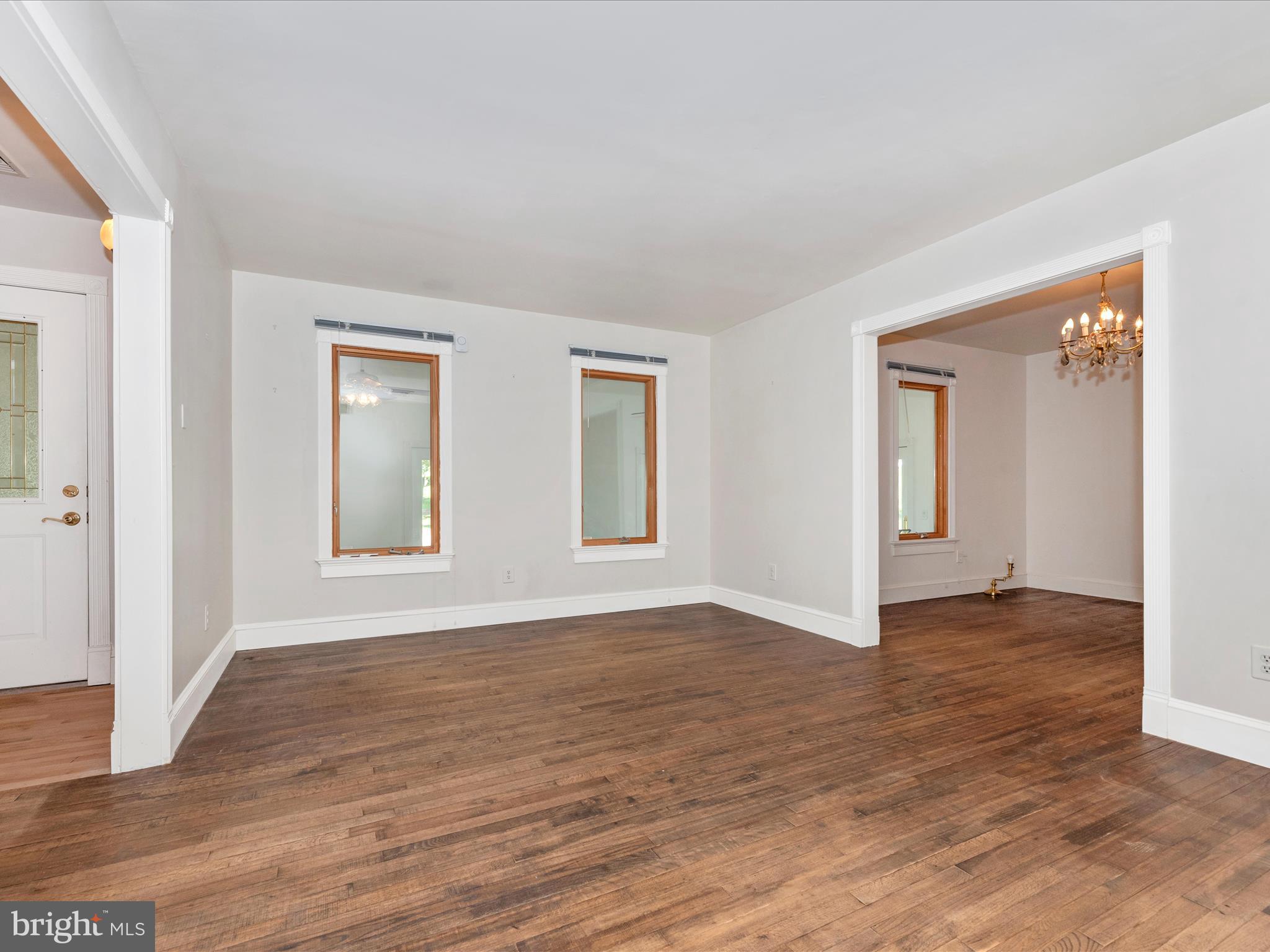 2313 Bidle Road Middletown, MD 21769 - Photo 6 of 85 a view of an empty room with wooden floor and a window