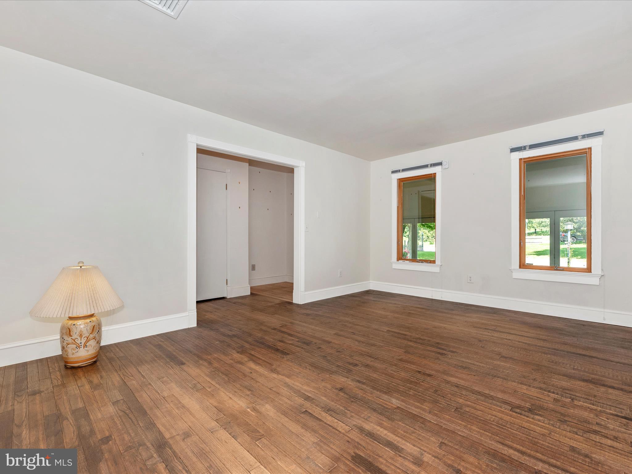 2313 Bidle Road Middletown, MD 21769 - Photo 7 of 85 a view of an empty room with window and wooden floor