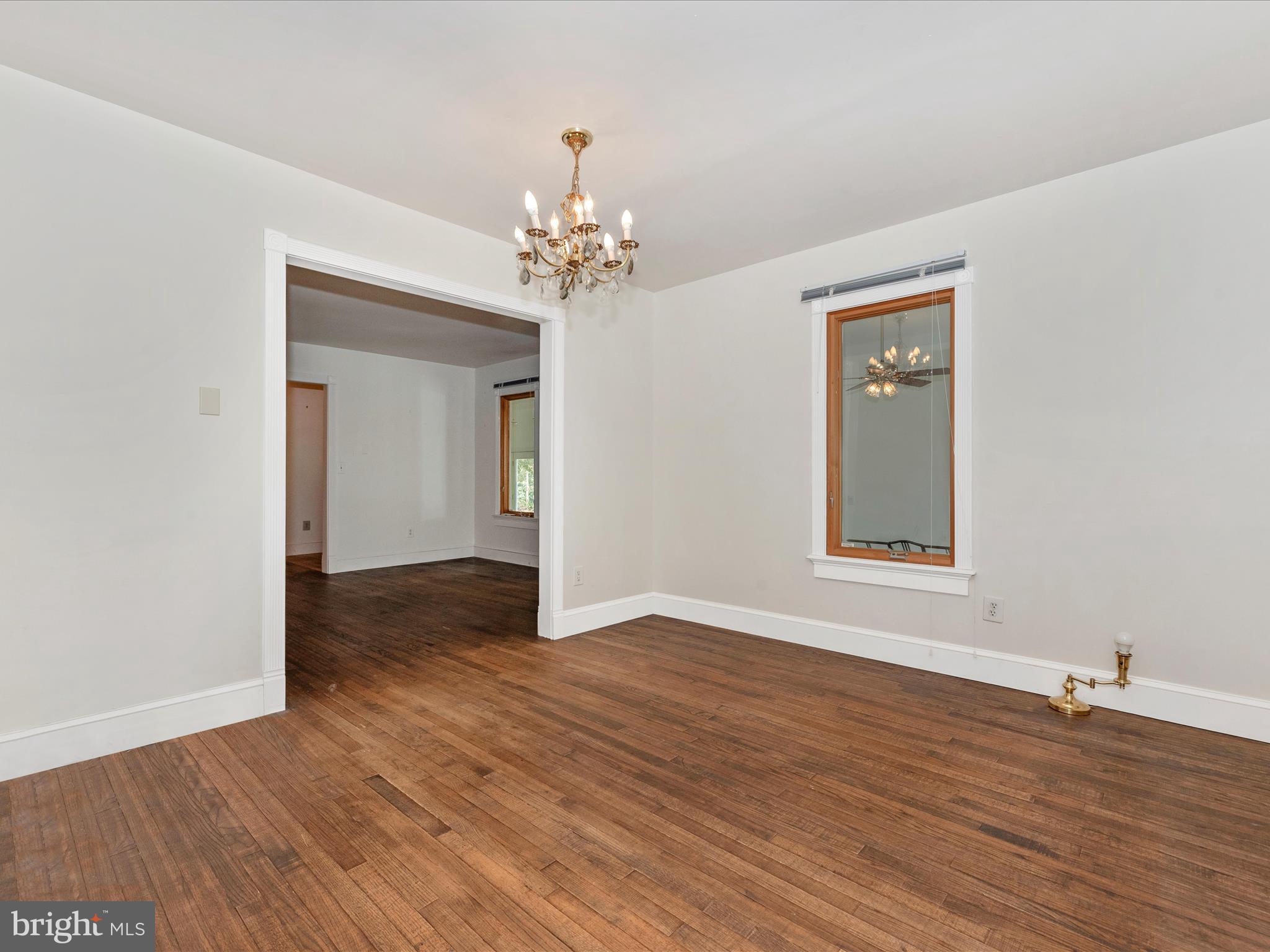 2313 Bidle Road Middletown, MD 21769 - Photo 10 of 85 a view of an empty room with wooden floor and a window