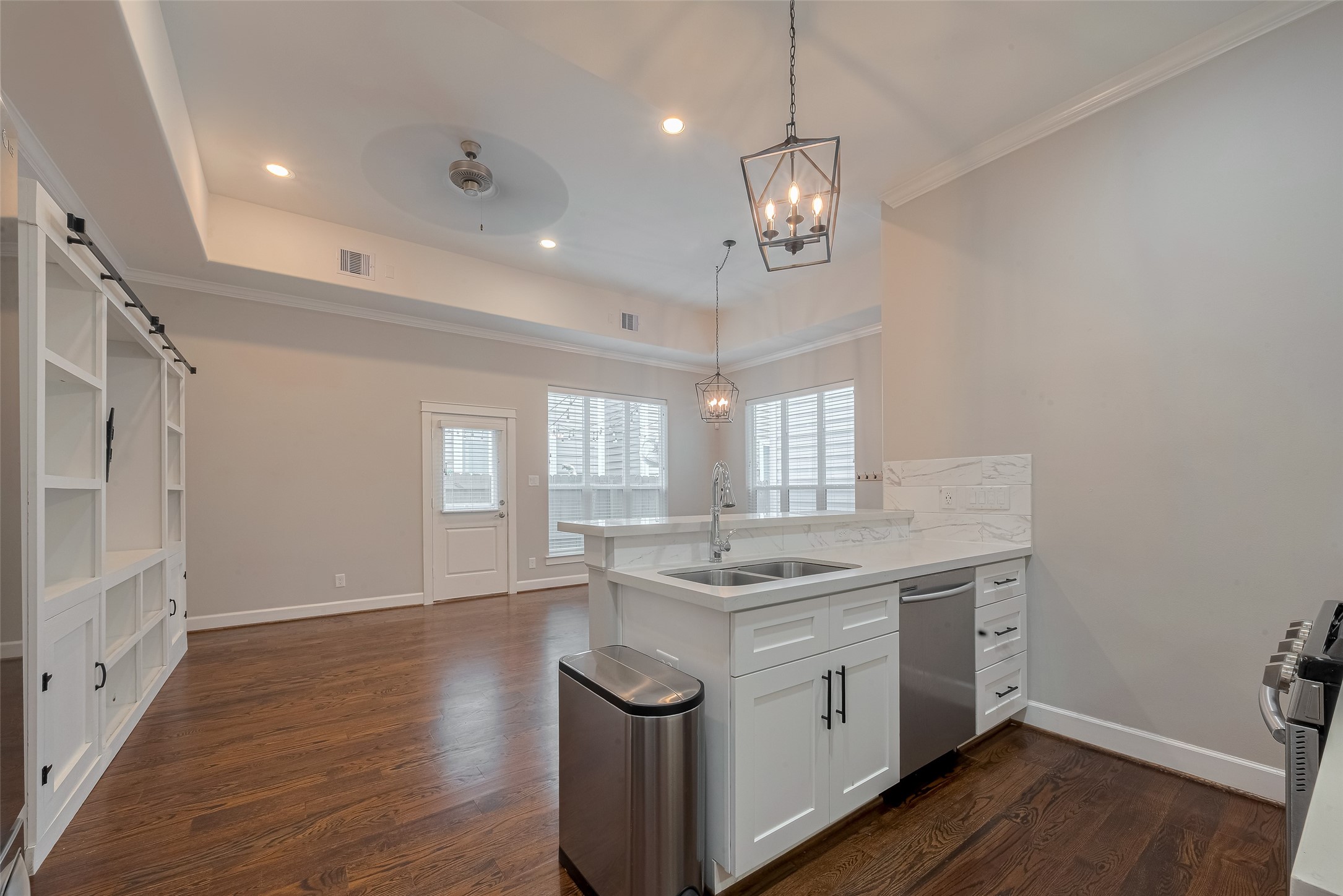 854 West 20th Street Houston, TX 77008 - Photo 10 of 40 a kitchen with a sink stove and wooden floor