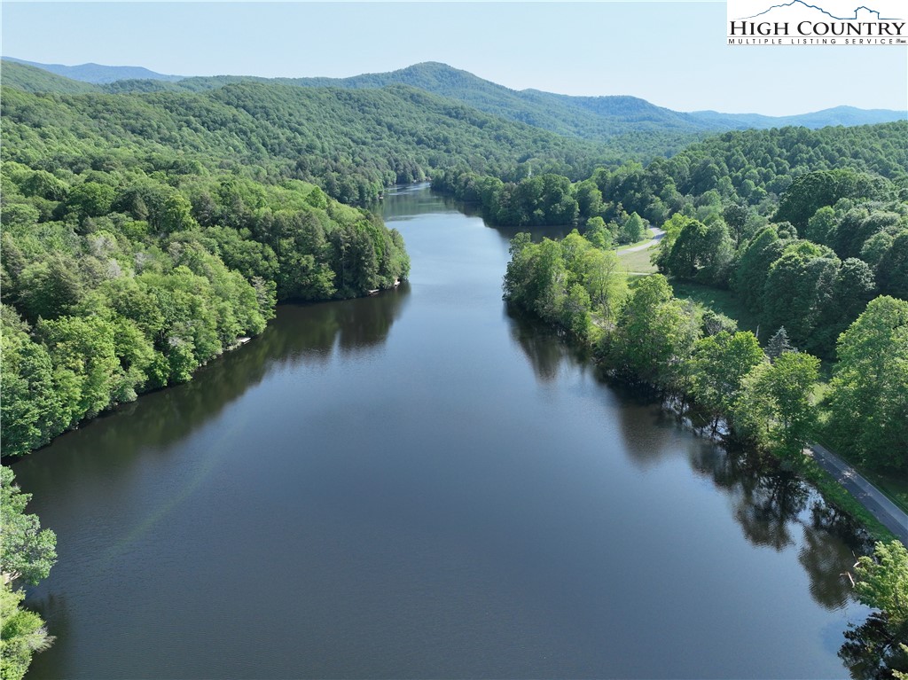 1764 Ripshin Mountain Road Roan Mountain, TN 37687 - Photo 4 of 33 a view of a lake with mountain