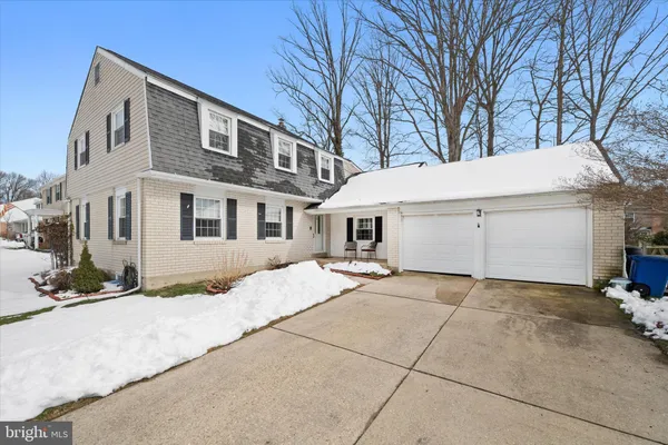 a view of a house with a snow in the yard