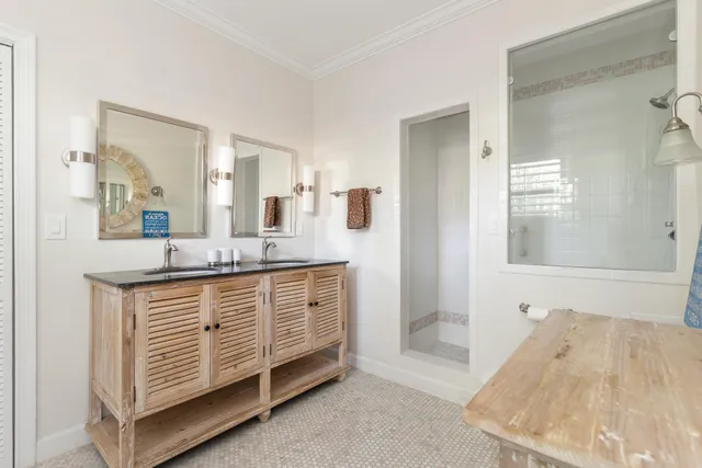 a bathroom with a sink a mirror and a bathtub