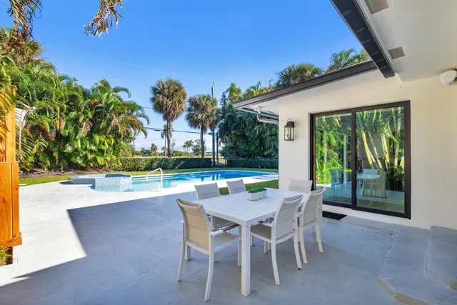 a patio with table and chairs