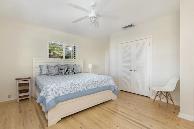 a bedroom with a bed and a table