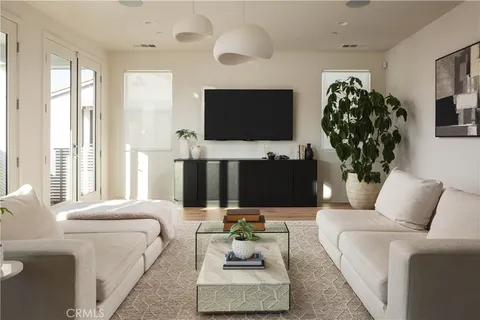 a living room with furniture fireplace and flat screen tv