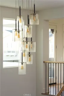 a bathroom with a glass shower door and a window