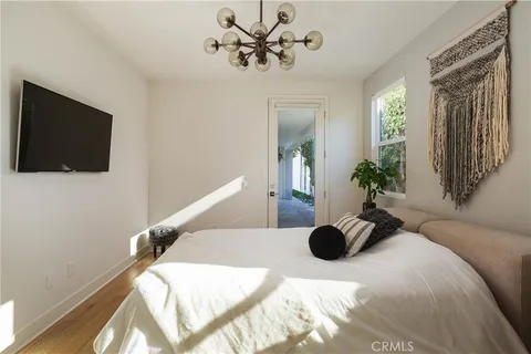a view of a livingroom with furniture and flat screen tv