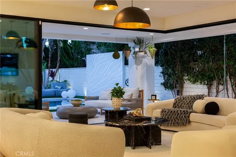 a living room with furniture a lamp and a fountain