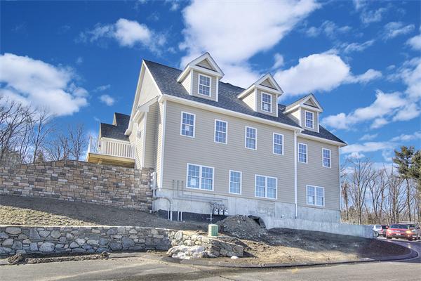15 Littleton Road, Unit 2B Harvard, MA 01451 - Photo 1 of 29 a front view of a house with yard
