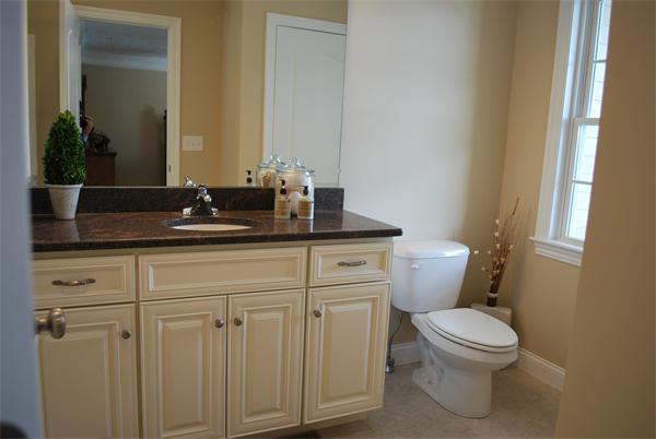 15 Littleton Road, Unit 2B Harvard, MA 01451 - Photo 14 of 29 a bathroom with a granite countertop toilet sink and mirror