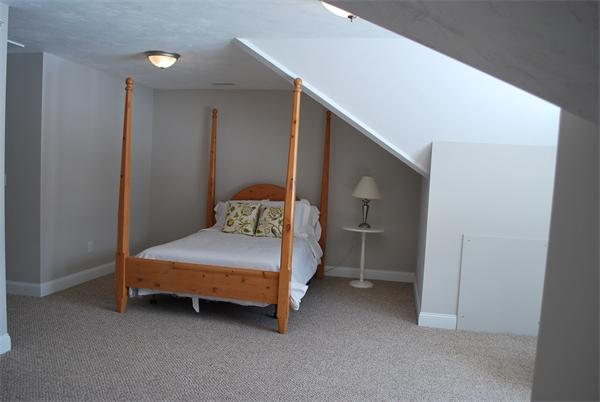 15 Littleton Road, Unit 2B Harvard, MA 01451 - Photo 19 of 29 a bedroom with a bed and a cabinets