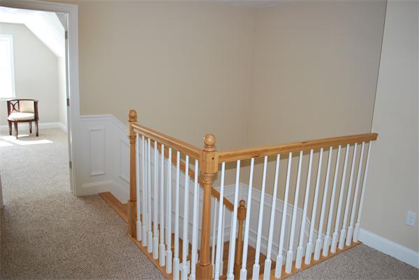 15 Littleton Road, Unit 2B Harvard, MA 01451 - Photo 24 of 29 a view of a hallway with white walls and stairs