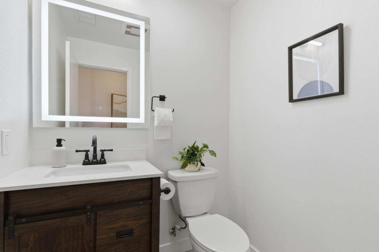 538 Dean Street Hayward, CA 94541 - Photo 11 of 25 a bathroom with a sink a toilet and mirror