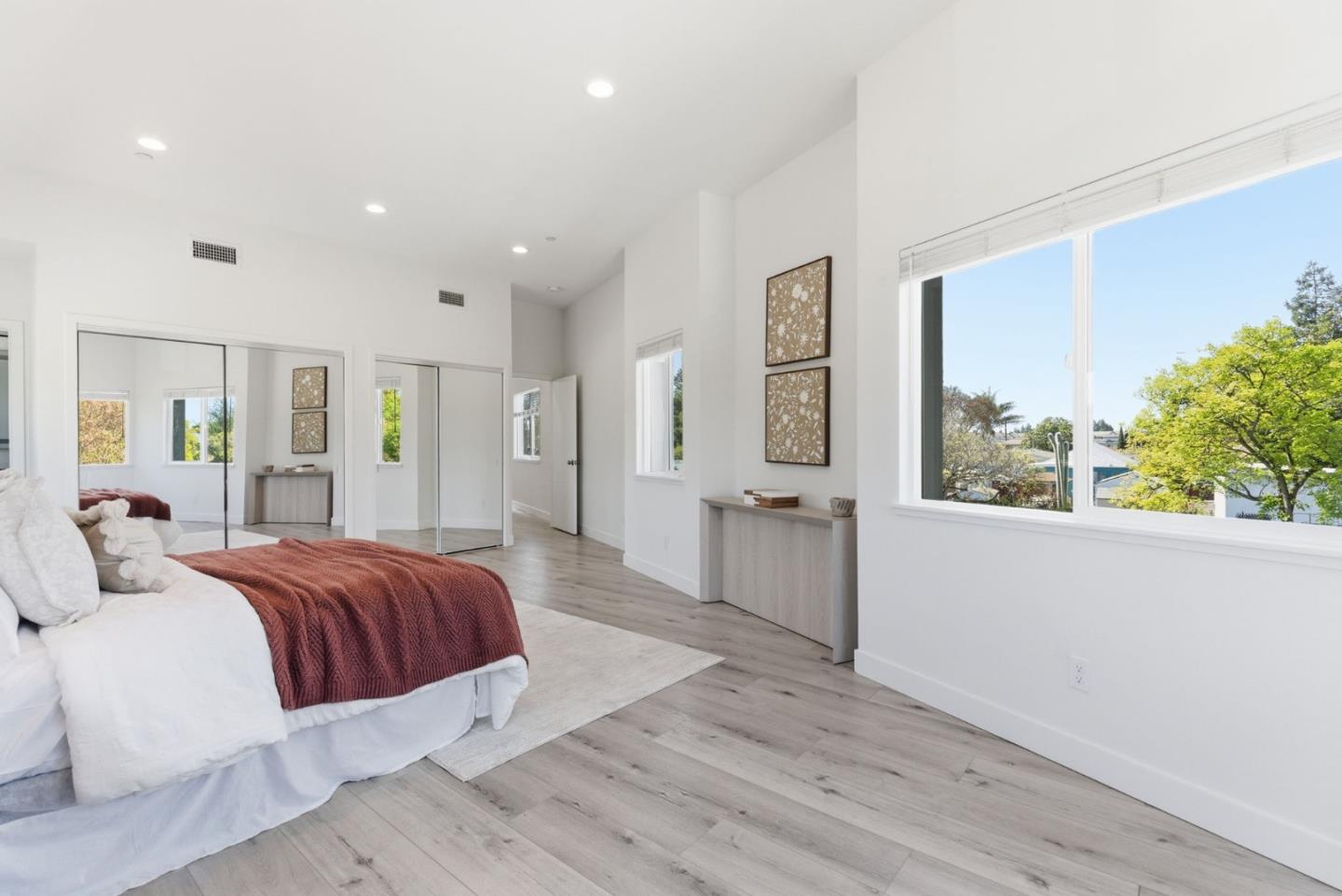 538 Dean Street Hayward, CA 94541 - Photo 14 of 25 a spacious bedroom with a large bed and a large window