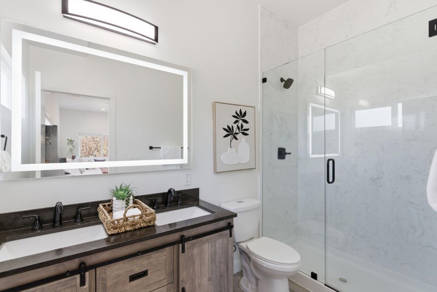 538 Dean Street Hayward, CA 94541 - Photo 16 of 25 a bathroom with a granite countertop sink mirror toilet and shower