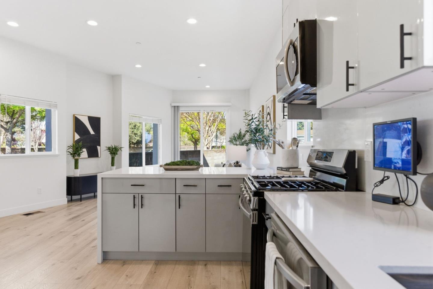 538 Dean Street Hayward, CA 94541 - Photo 5 of 25 a kitchen with a sink a stove and cabinets