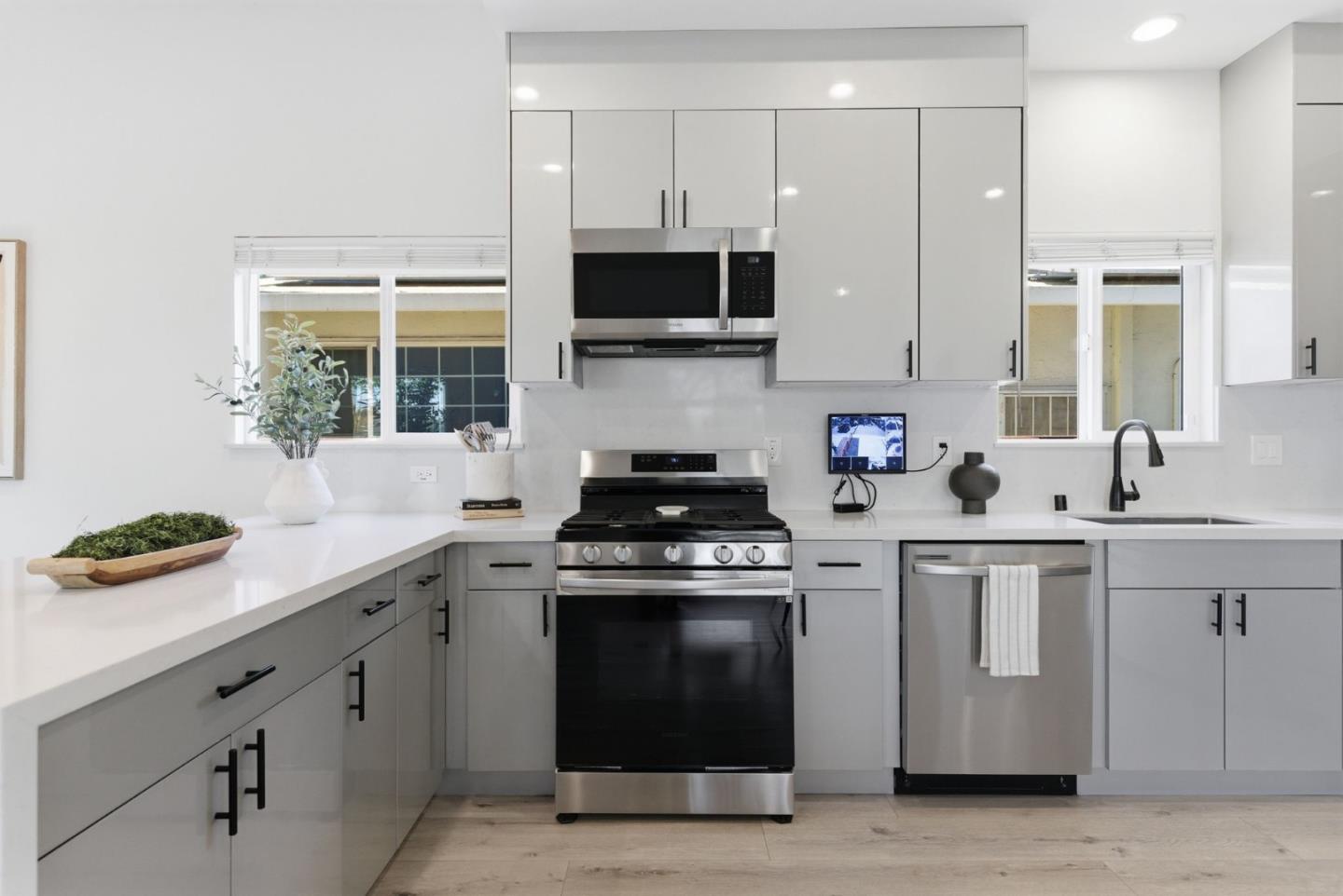 538 Dean Street Hayward, CA 94541 - Photo 6 of 25 a kitchen with stainless steel appliances granite countertop a sink and a stove