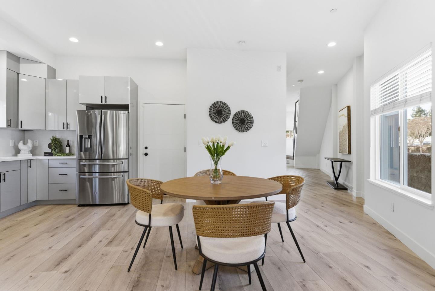 538 Dean Street Hayward, CA 94541 - Photo 10 of 25 a kitchen with stainless steel appliances granite countertop a kitchen island hardwood floor sink stove dining table and chairs
